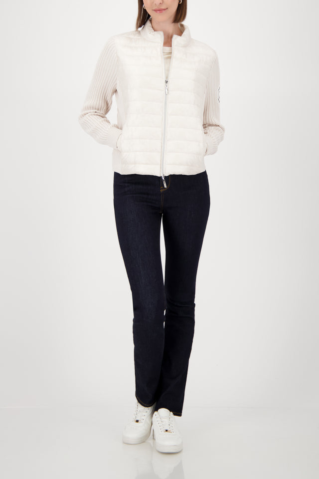 Quilted jacket with knitted sleeves