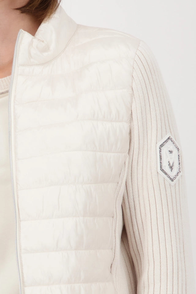 Quilted jacket with knitted sleeves