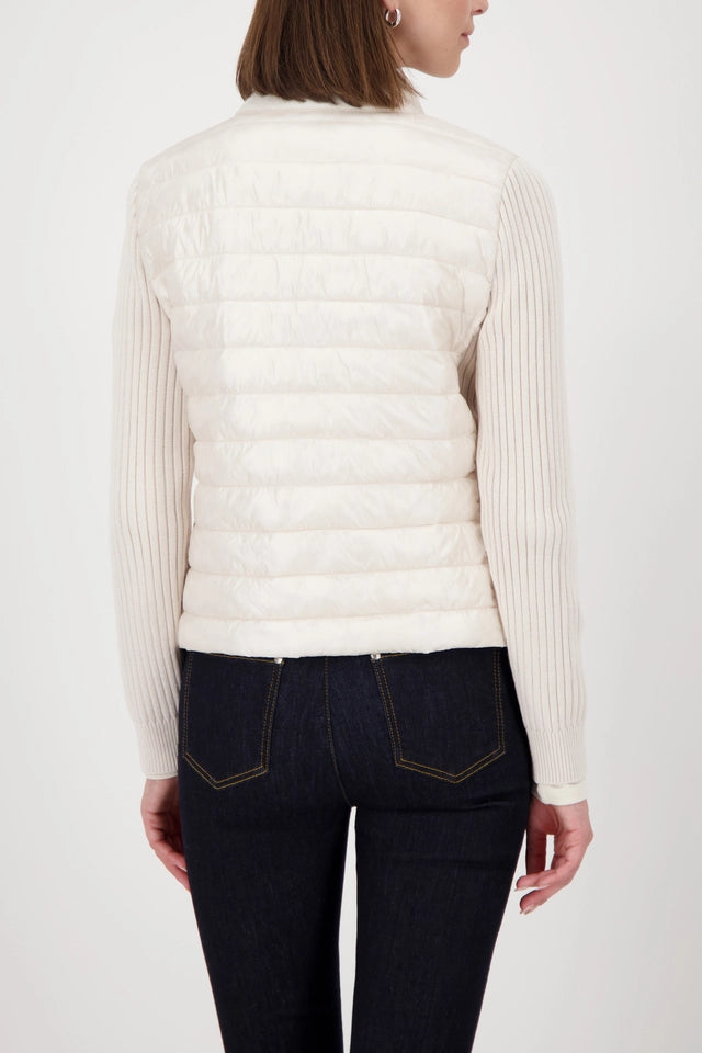 Quilted jacket with knitted sleeves